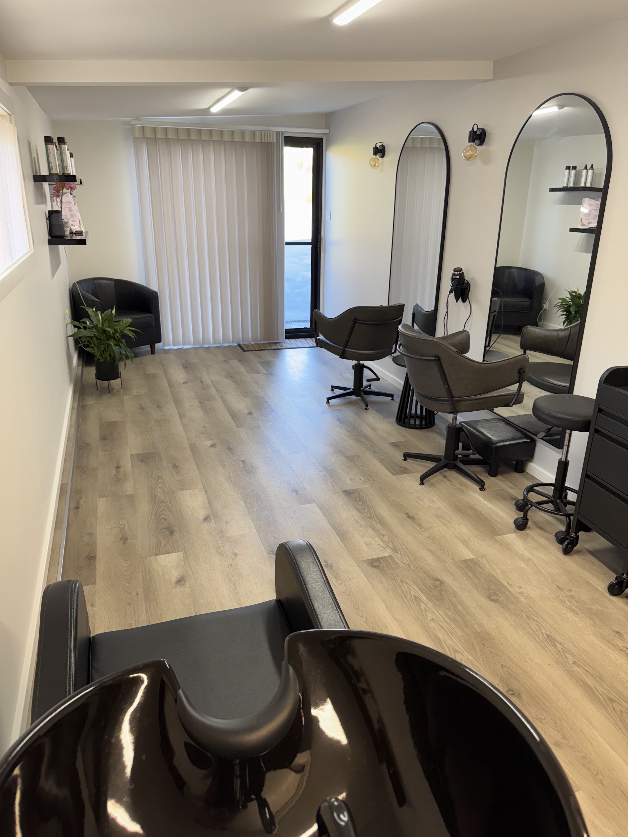 Inside Studio MB Hair: arched mirrors, styling chairs and timber floors