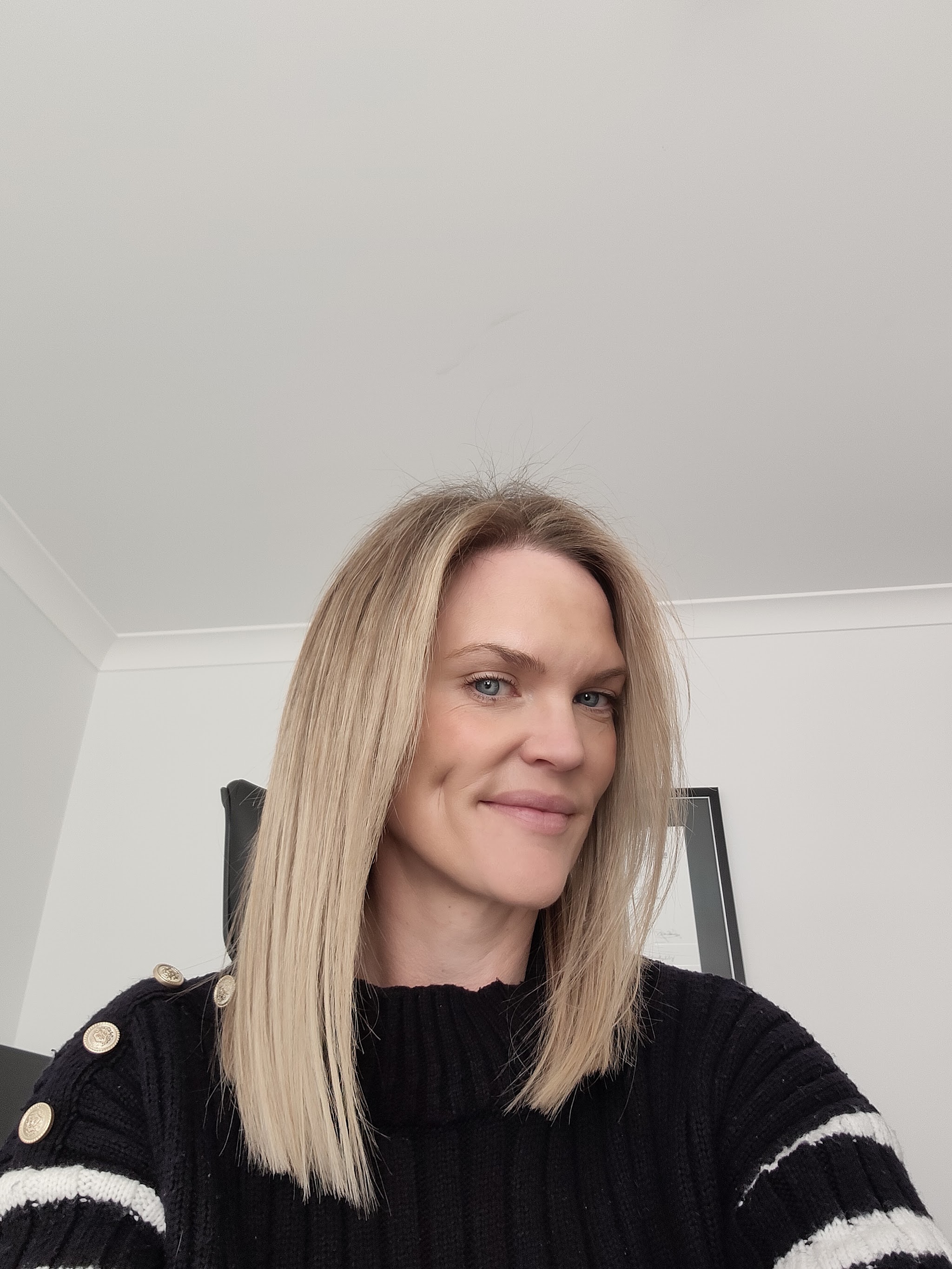 A client with a sleek, polished blonde finish